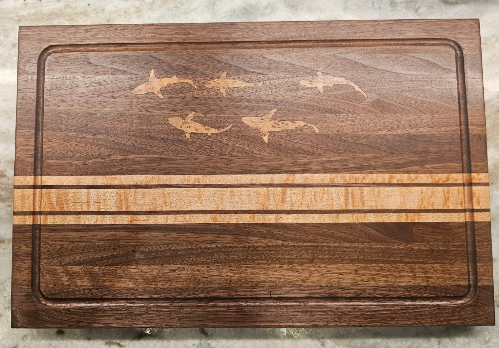 Handmade walnut/birdseye factory maple paddle style cutting boards